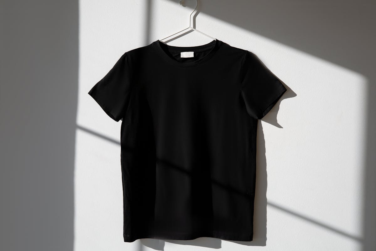 a black shirt hanging on the wall
