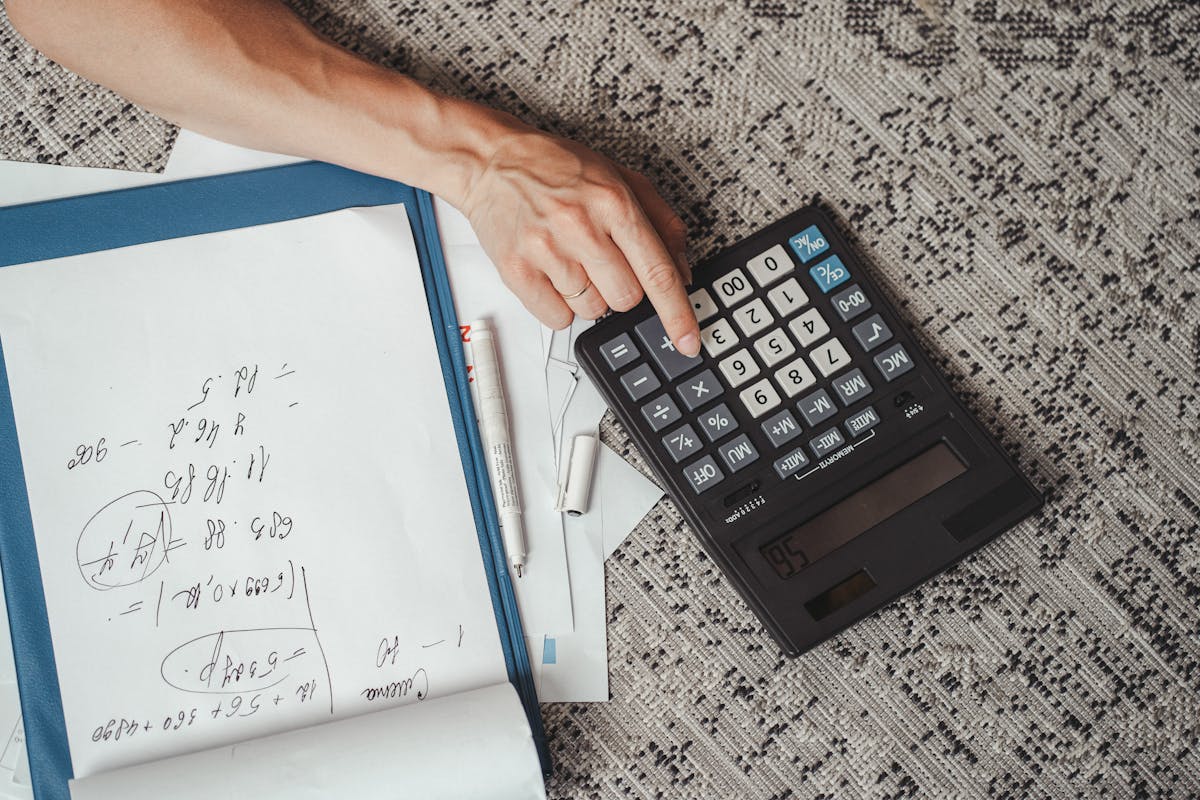 a person using a calculater
