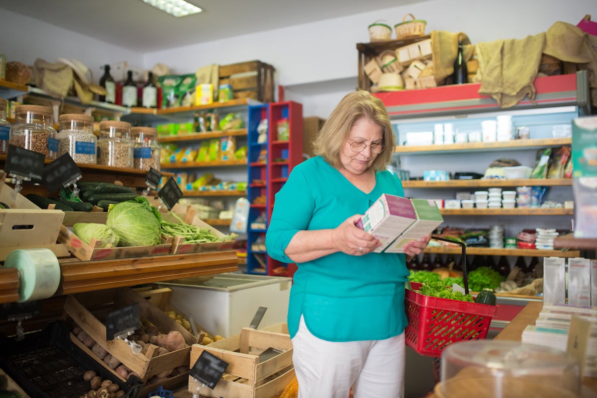 a woman deciding on what to buy