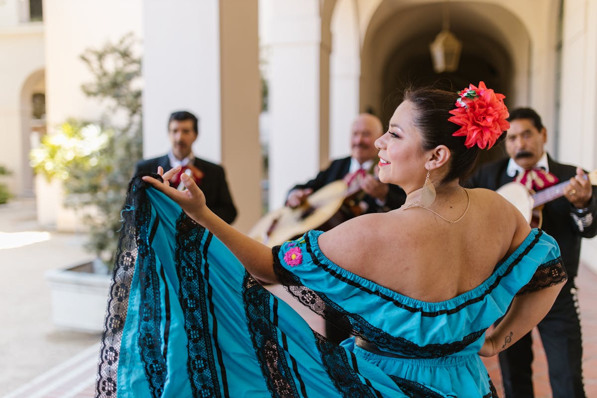 a woman in blue dress dancing