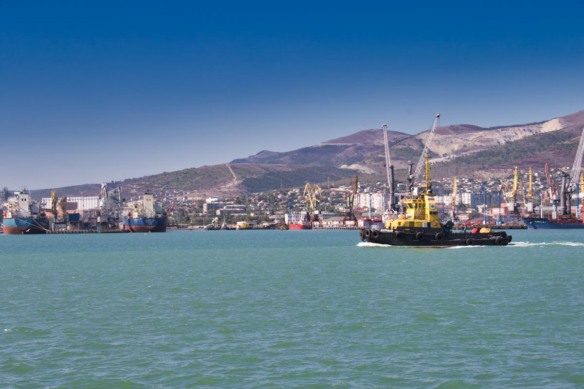 a yellow tugboat sailing
