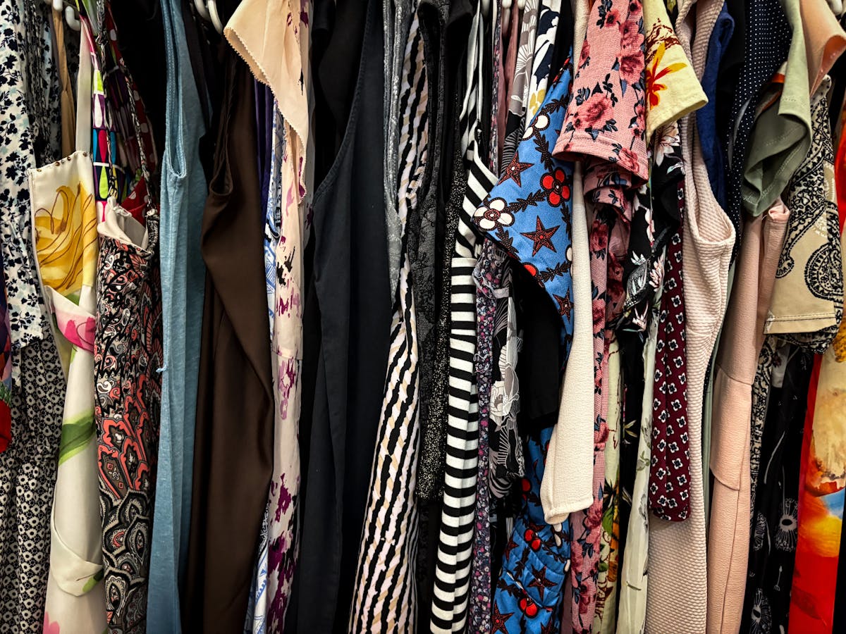 colorful rack of vintage clothes for thrifting colorful rack of vintage clothes for thrifting