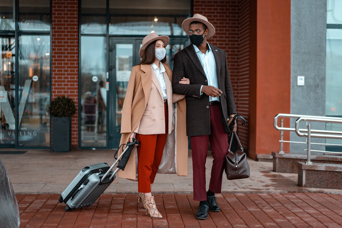 couple standing outside of the hotel