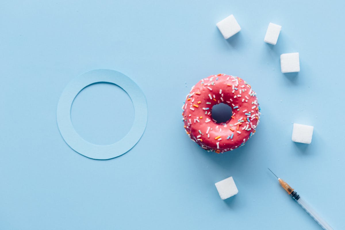 doughnut with sprinkles on white table