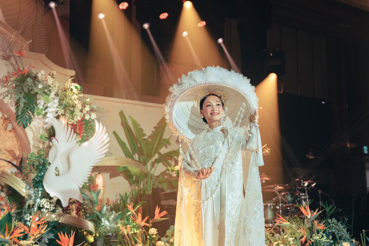 elegant woman in traditional costume under stage lights
