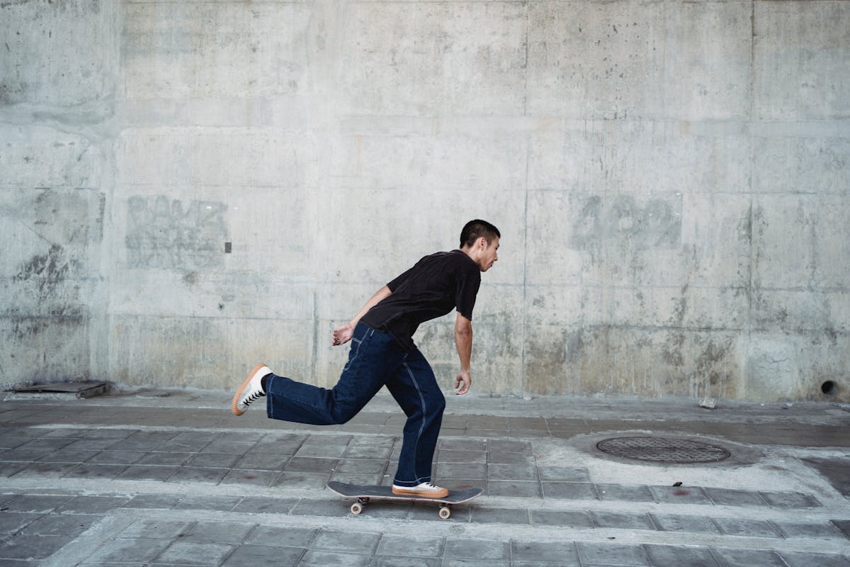 energetic man on skateboard in street