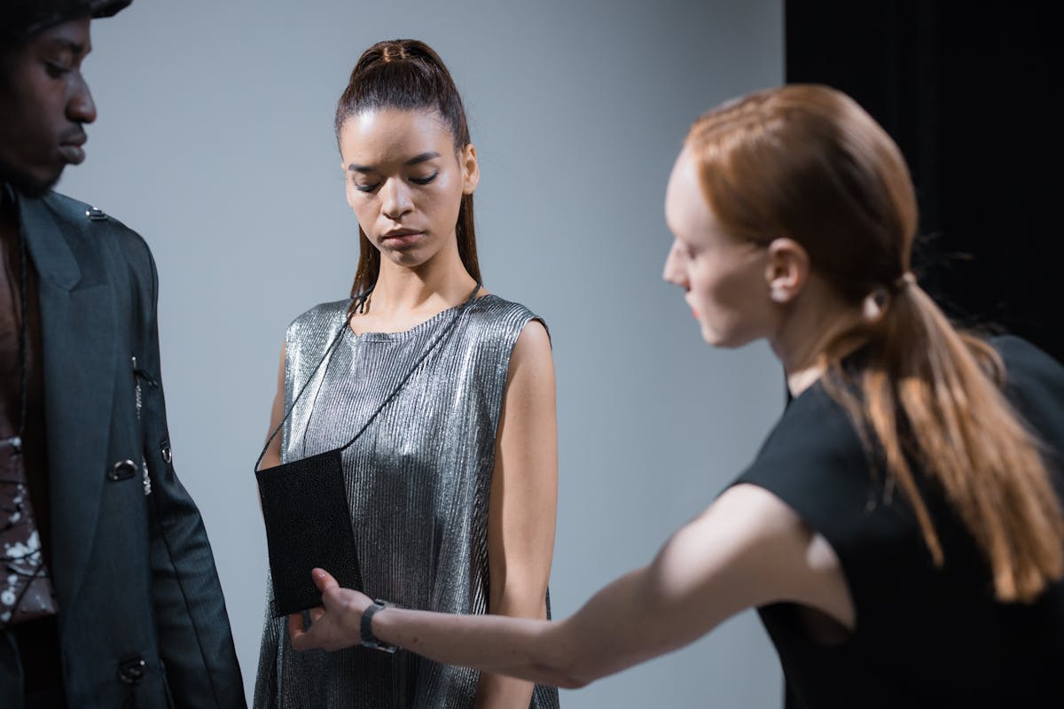 fashion designer preparing the models