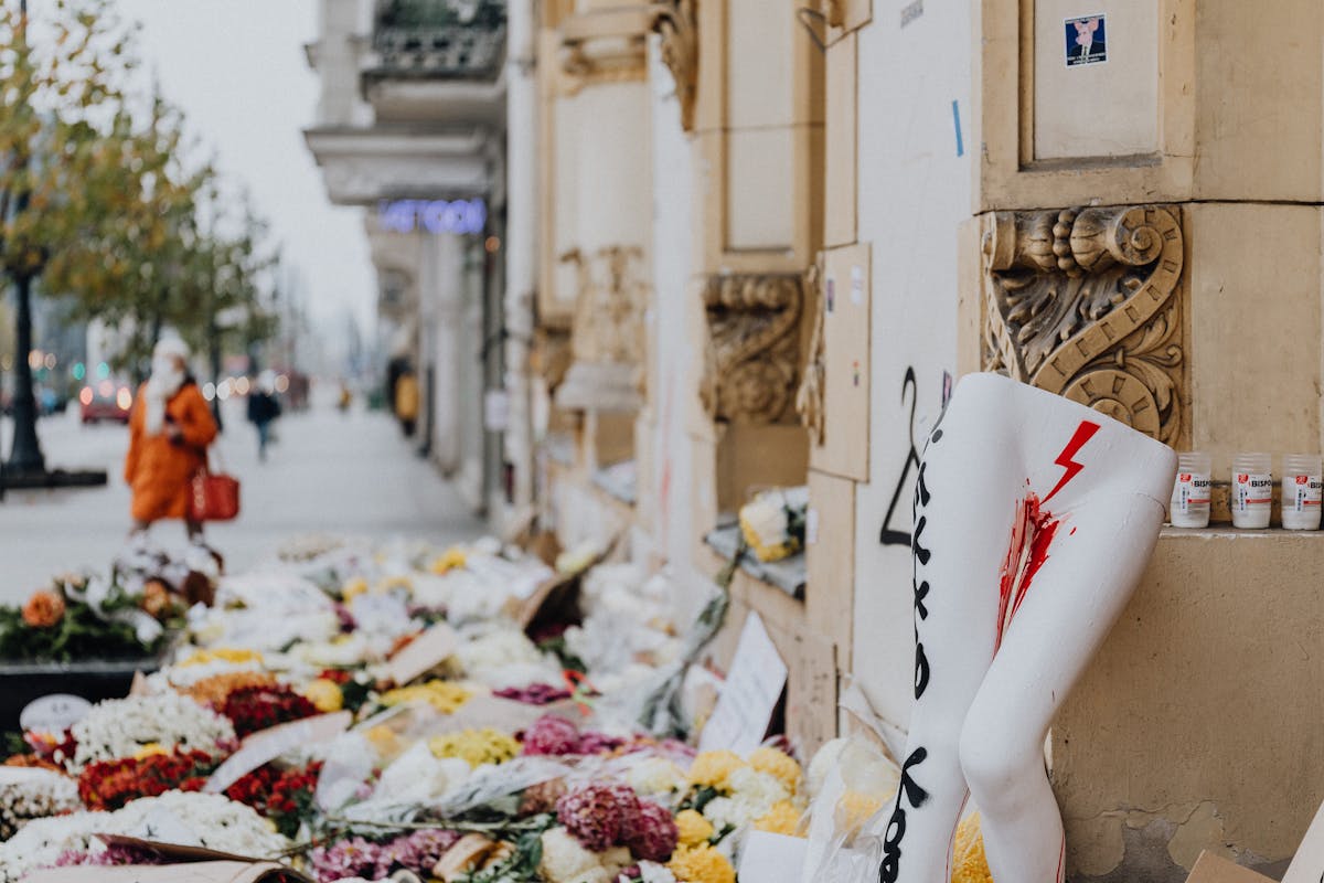 flowers laid down on human rights protest in poland