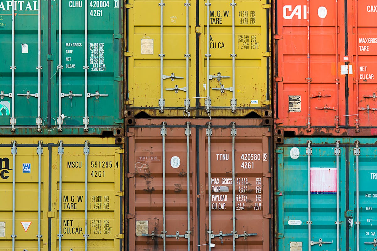 green and brown cargo containers