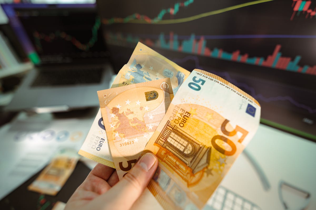 hand holding banknote euro currency