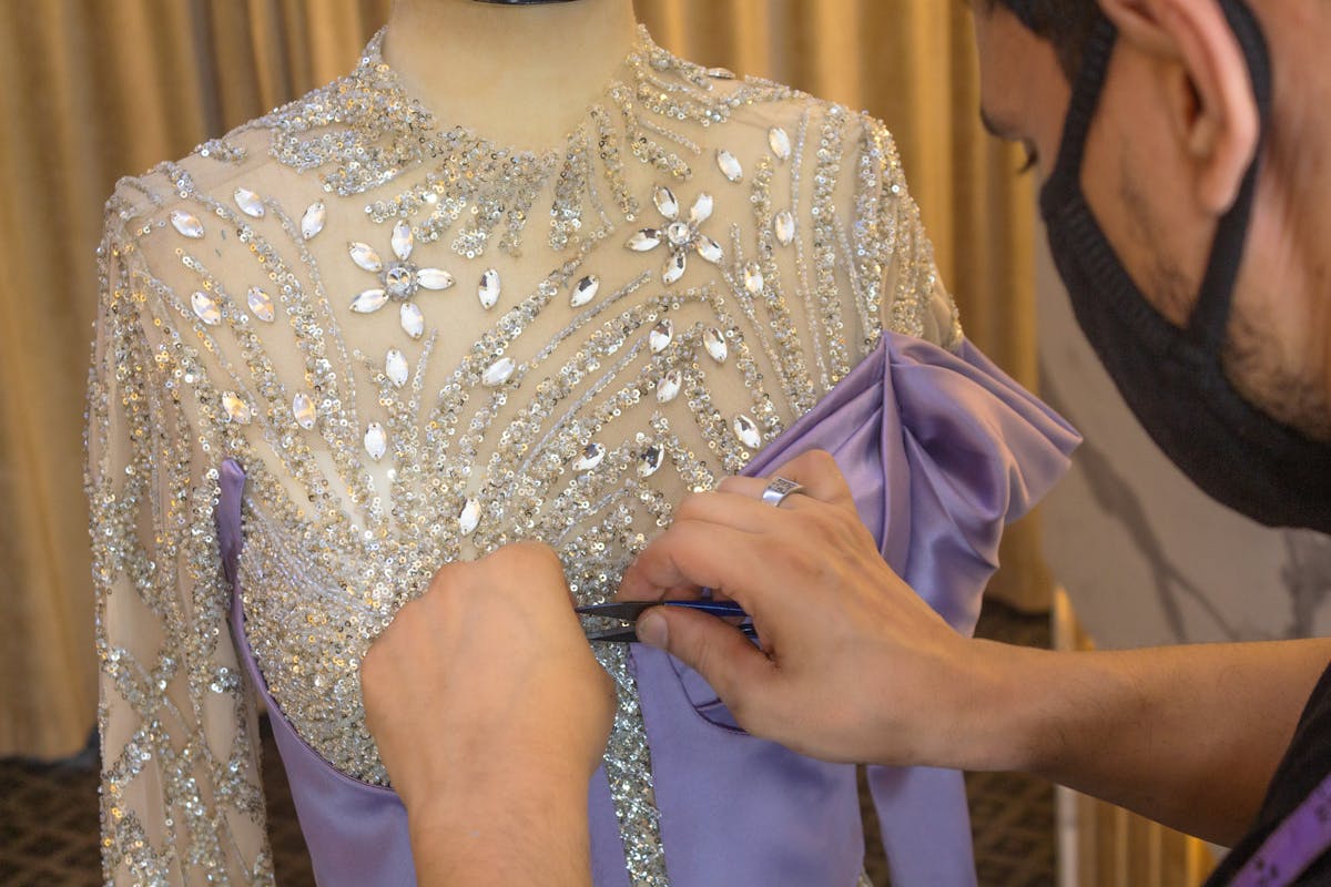 man designing dress
