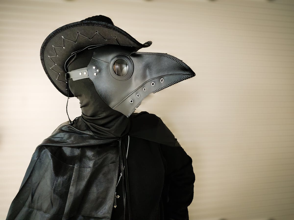 mysterious plague doctor in historical costume
