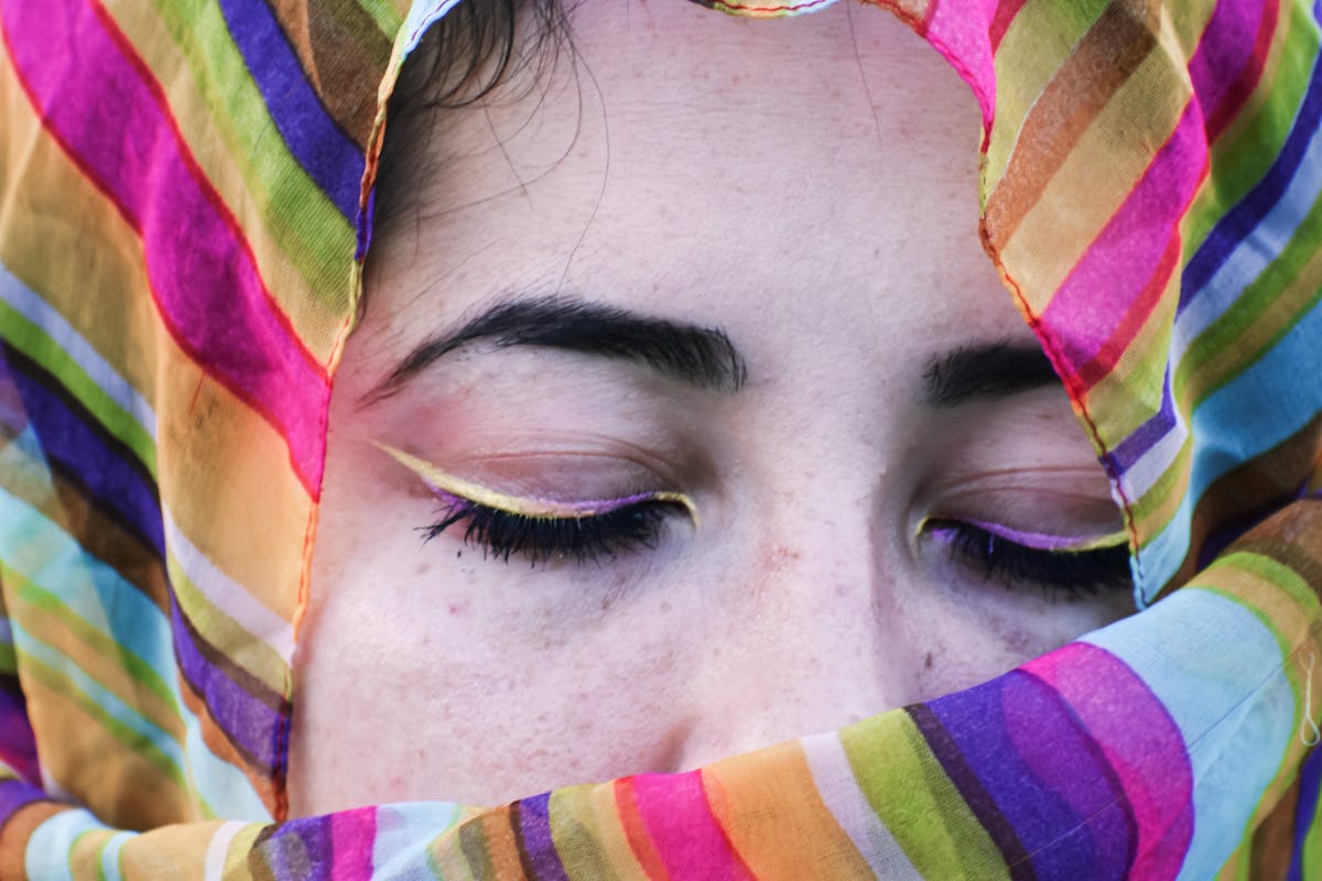 serene woman in colorful headscarf