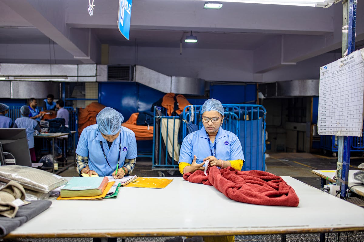 textile factory workers sorting fabric