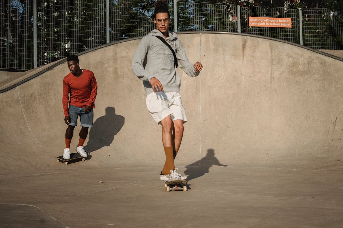 two skateboarding men