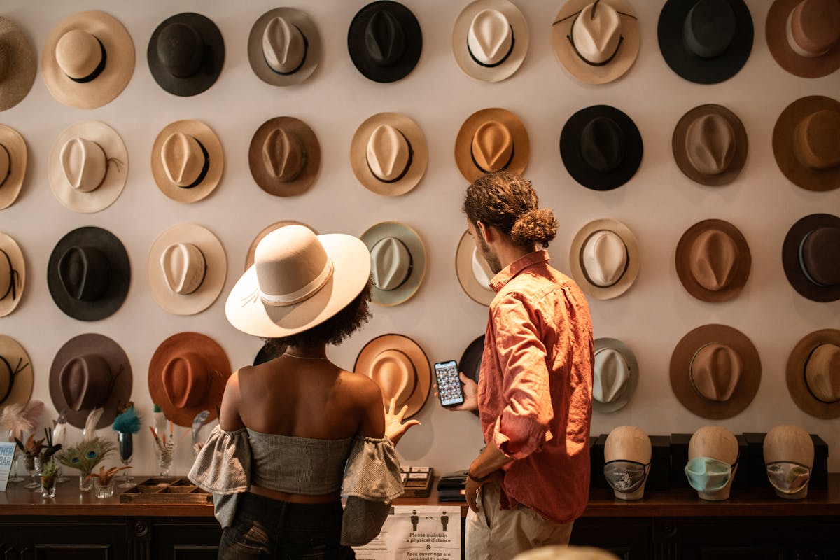 woman in black tube top and white fedora hat
