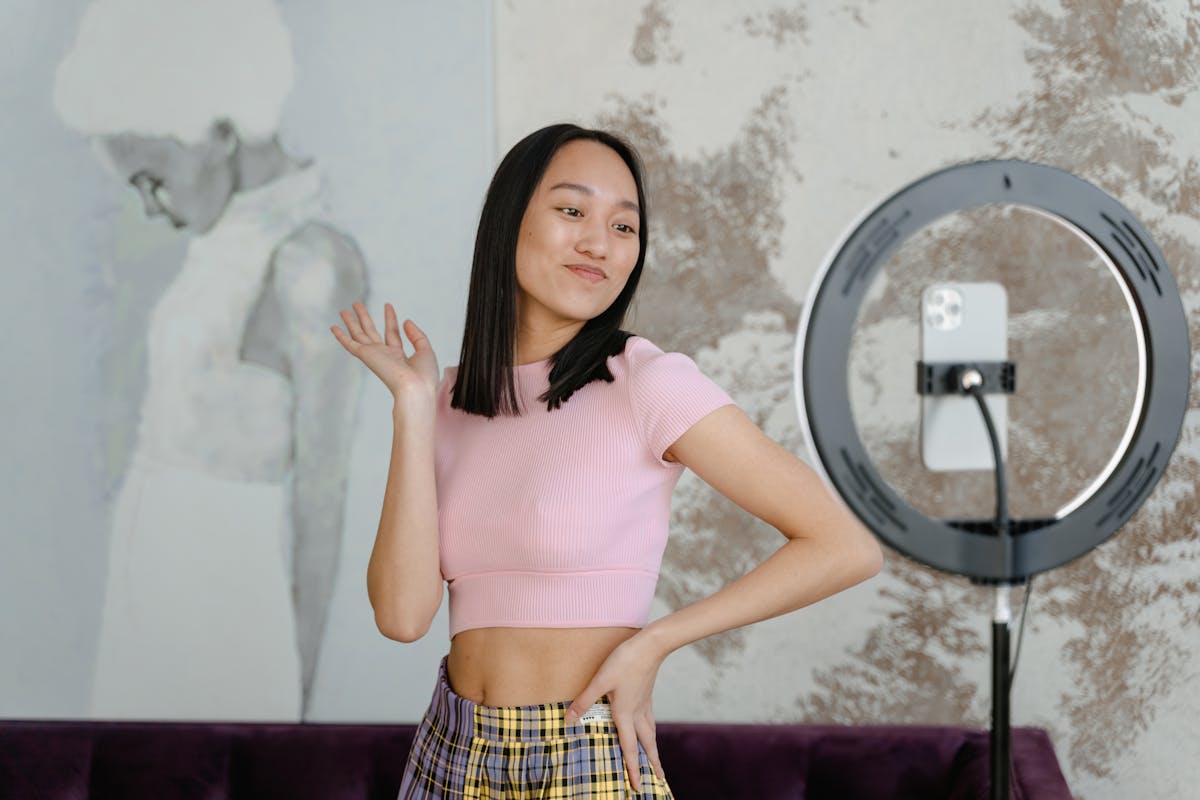 woman in pink shirt and yellow and black plaid skirt