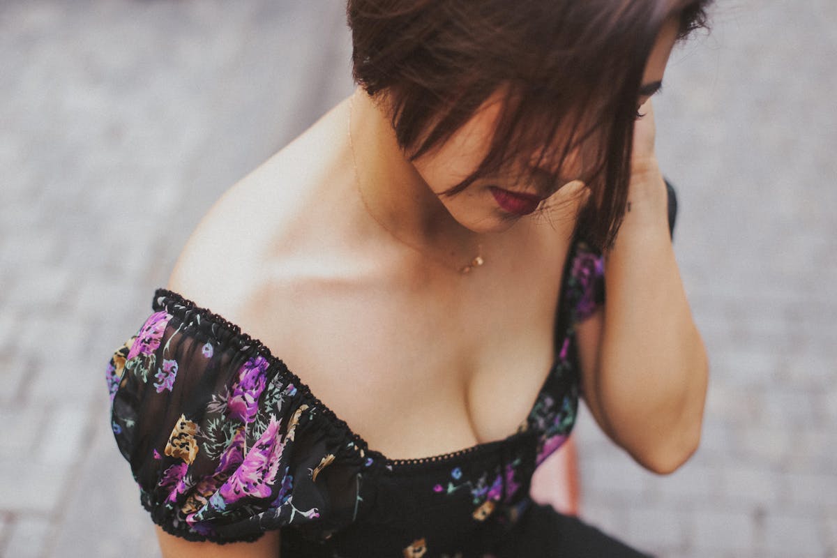woman wearing black floral top