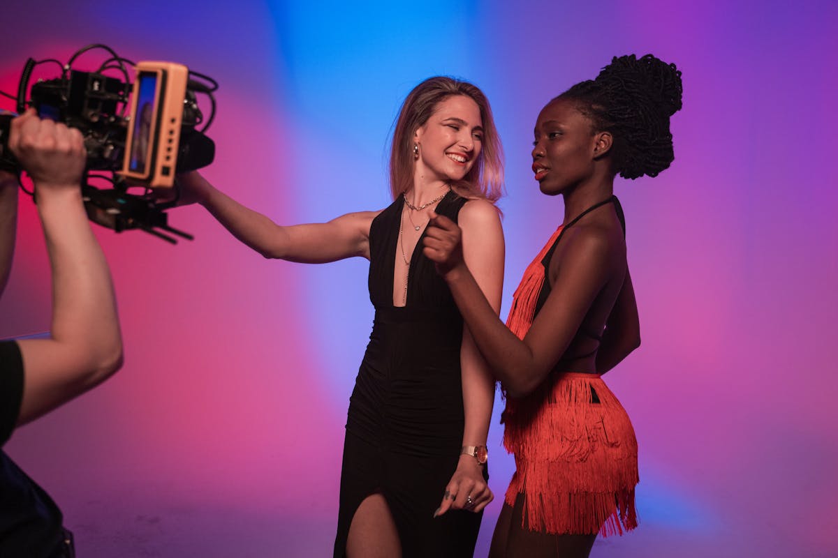 women wearing party dresses and dancing